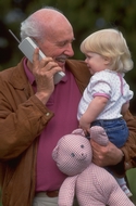 grandfather holding granddaughter